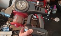 Aspirateur balai démonté avec module principal ouvert